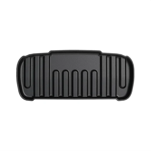 Cast iron grill pan with raised ridges for searing food, horizontal grooved surface and curved edges center-aligned on white background.