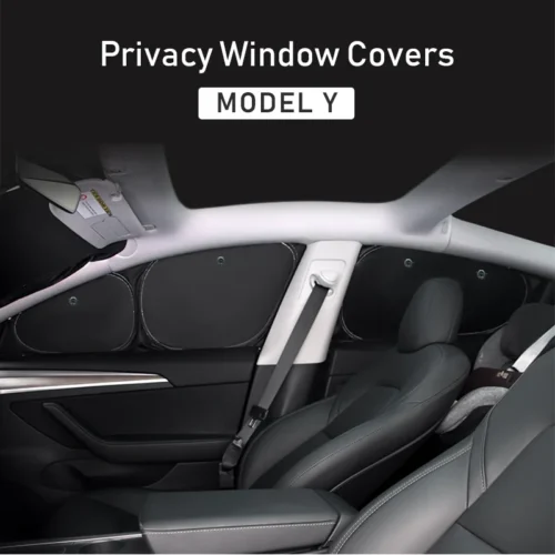 Tesla Model Y interior with privacy window covers across rear side windows, dark seats visible.