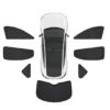 Top-down view of a white car surrounded by its complete set of window sun shades for sun protection.