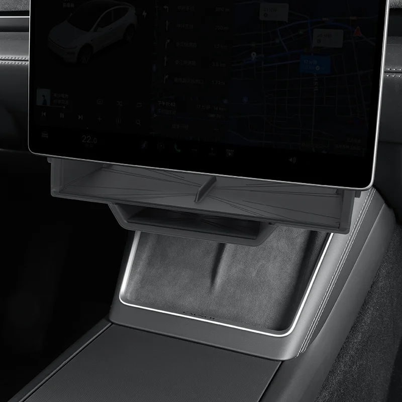 Center console with a mounted tablet displaying a navigation/map interface inside a car.