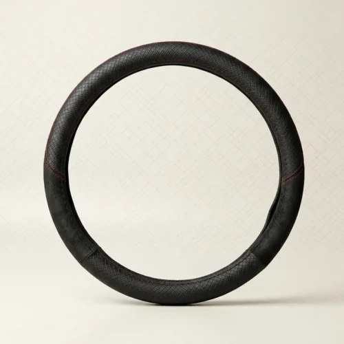 Black leather car steering wheel with red contrast stitching, shown upright on a light beige background.