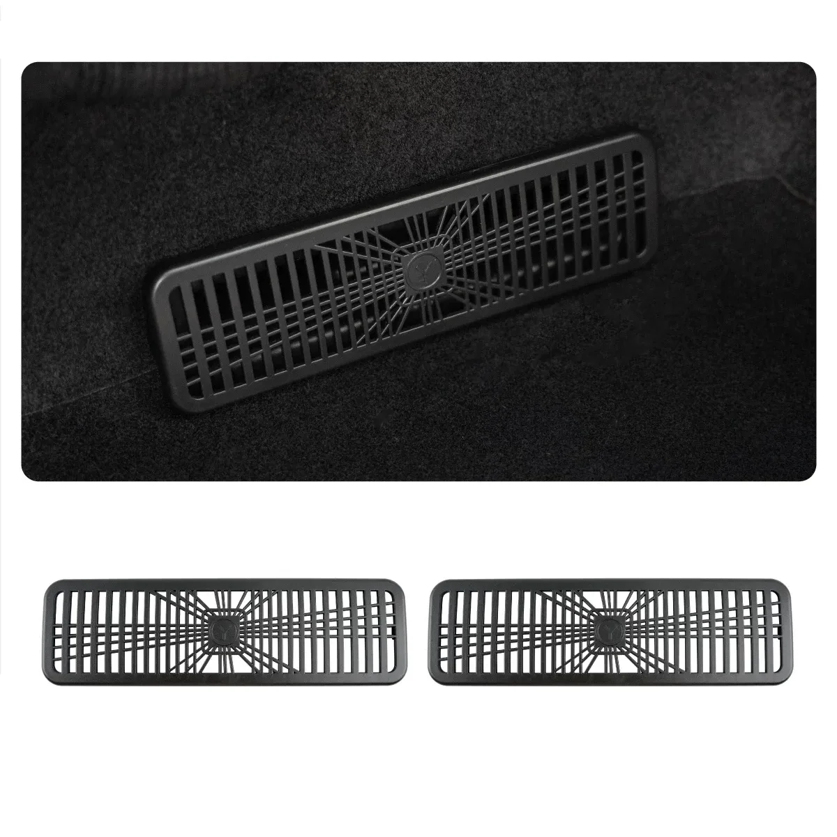 Rectangular car floor air vent/grille with a radial central hub and vertical slats, shown on a dark carpet; two similar vents below.