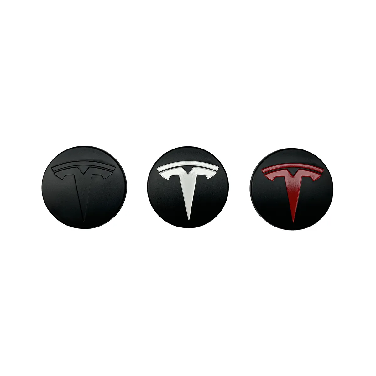 Row of three circular Tesla logos on black circles: left logo in dark/black, middle in white/silver, right in red.