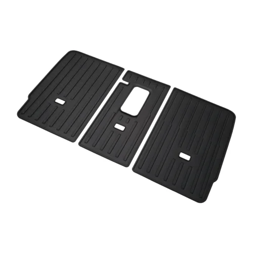 Set of three black ribbed rubber car floor mats arranged in a row, with the center mat featuring a large central cutout and two small rectangular openings.